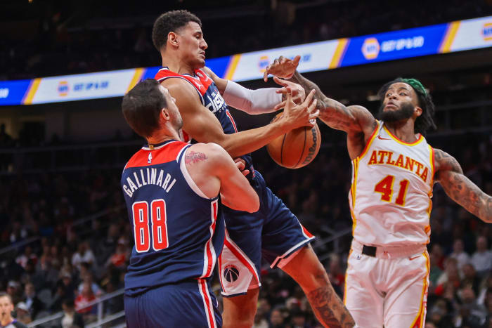 Nov 1, 2023; Atlanta, Georgia, USA; Washington Wizards guard Johnny Davis (1) grabs a rebound past Atlanta Hawks forward Saddiq Bey (41) in the second quarter at State Farm Arena. Mandatory Credit: Brett Davis-USA TODAY Sports